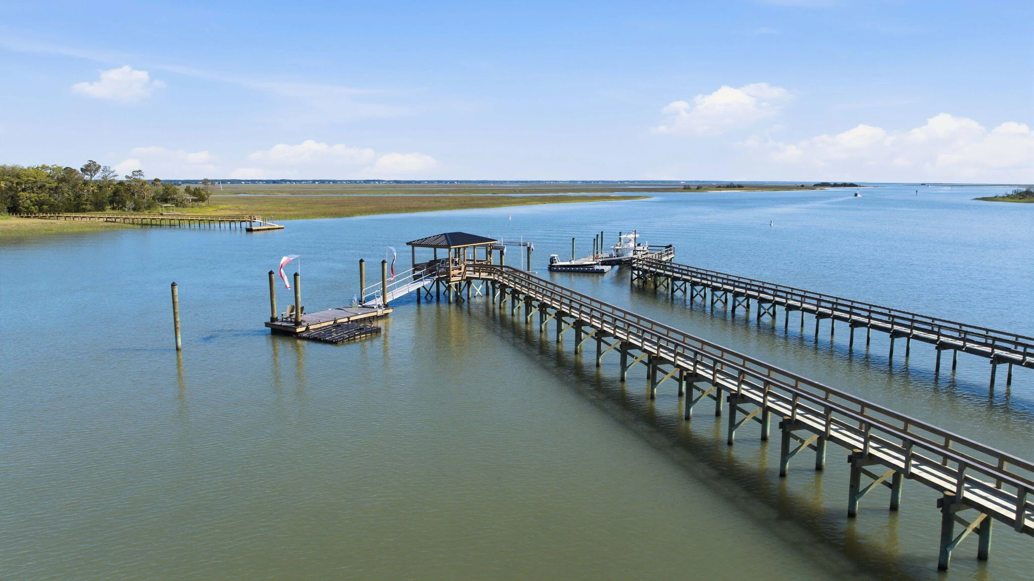 Private dock and covered pierhead extending into the deepwater creek