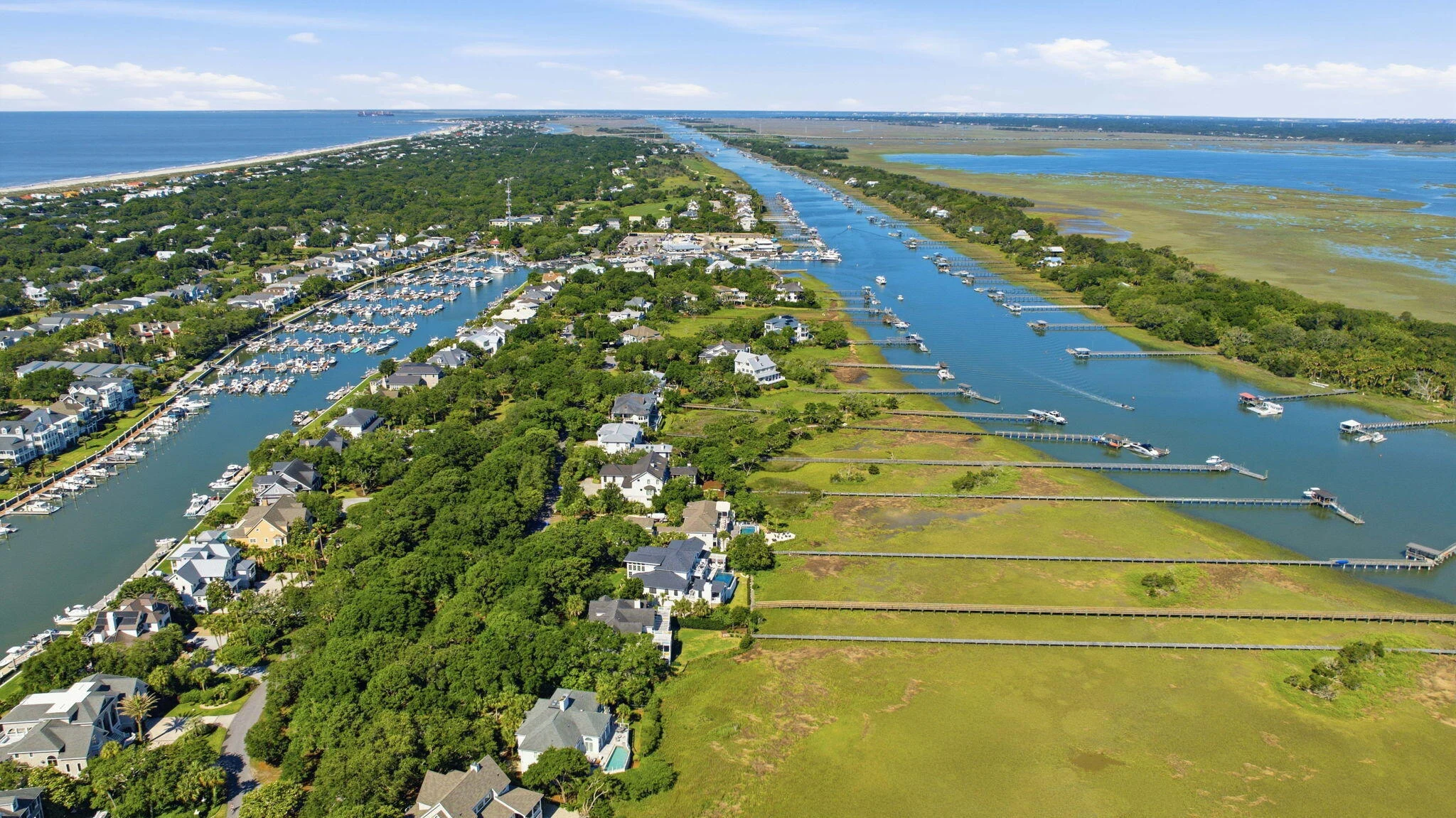 Aerial view of Waterway Island between the marina and the marsh-lined waterway
